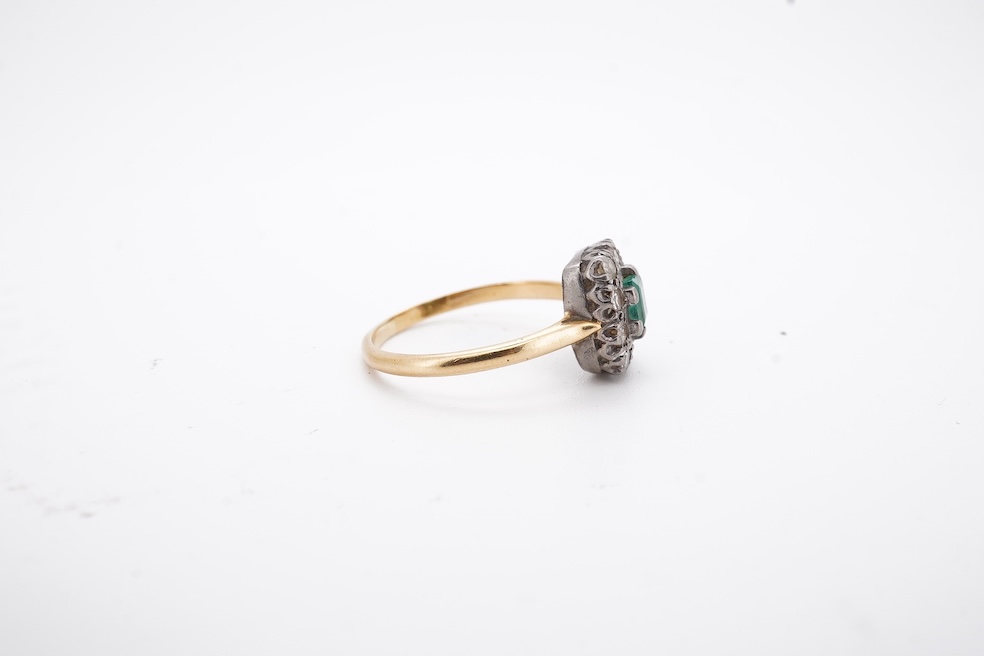 An early to mid 20th century yellow metal, emerald and diamond set rectangular cluster ring, size R, gross weight 3.5 grams. Condition - poor to fair